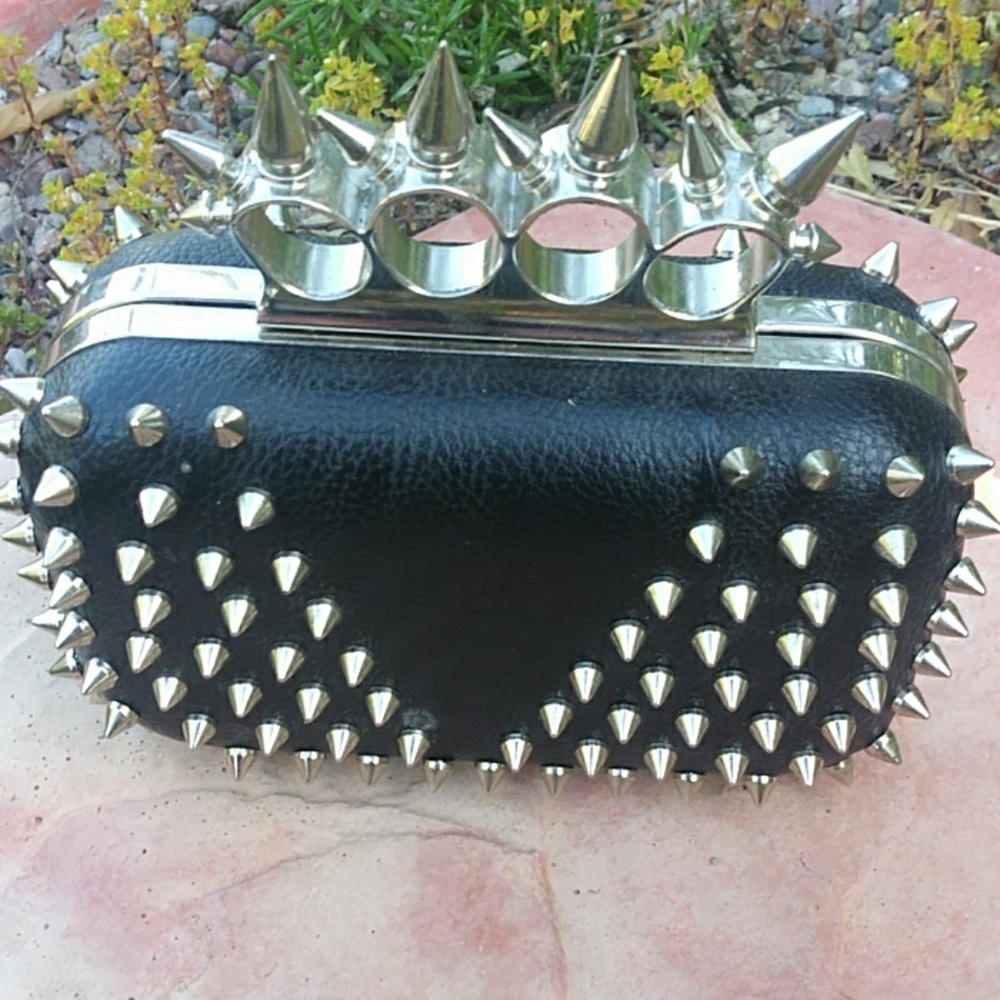 Spiked self-defense clutch